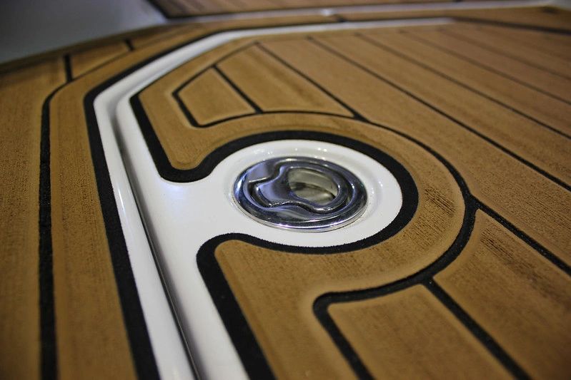 Custom SeaDek marine flooring with a teak-look pattern installed on a boat deck